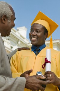 Father Giving Son Graduation Gift